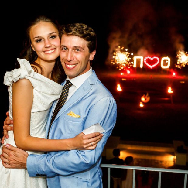 happy bride and groom hugging smiling on background firework happy bride and groom hugging smiling on background firework night